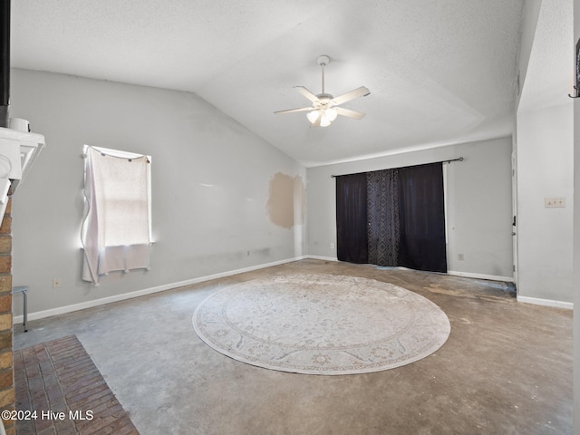 unfurnished bedroom featuring ceiling fan, lofted ceiling, and a textured ceiling