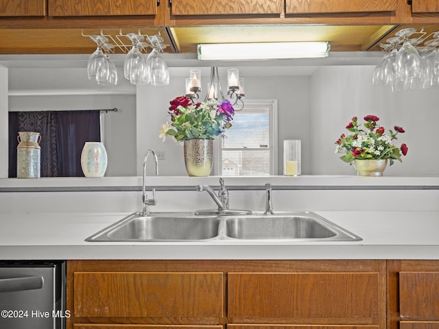 kitchen featuring stainless steel dishwasher and sink