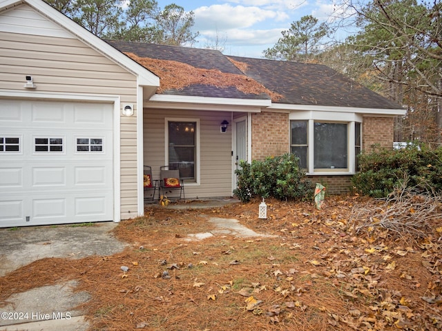 single story home with a garage