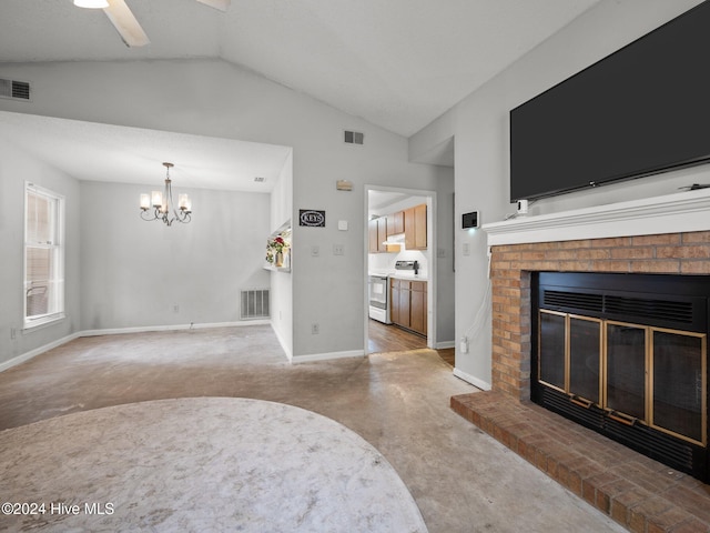 living room featuring ceiling fan with notable chandelier, lofted ceiling, carpet floors, and a brick fireplace