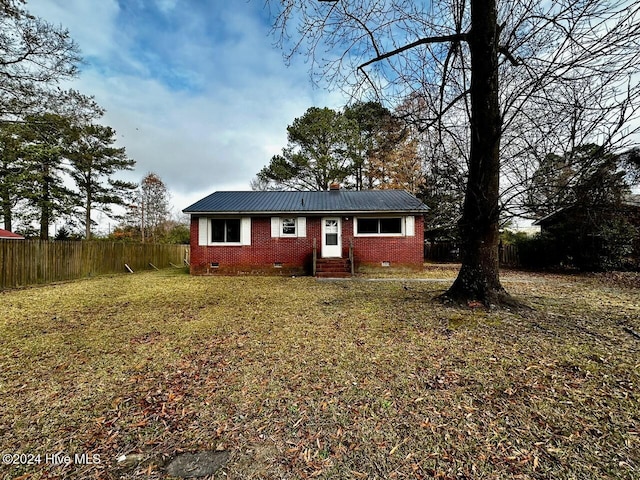 ranch-style home with a front lawn