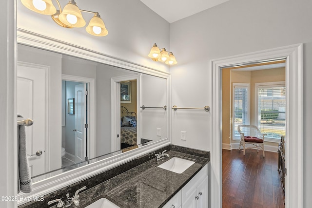 bathroom featuring hardwood / wood-style flooring, vanity, and toilet