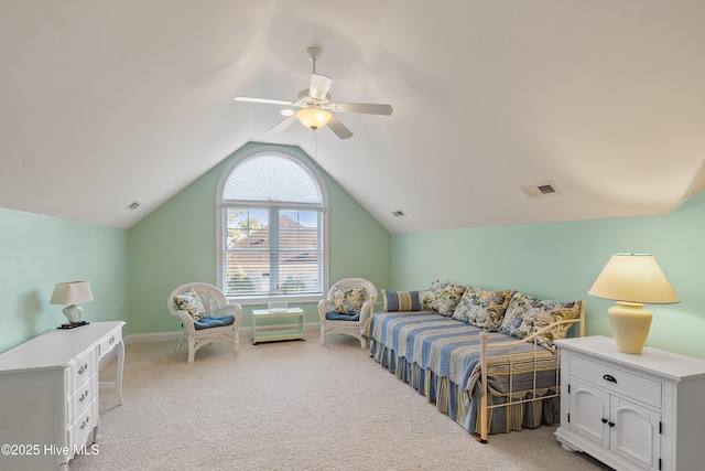 bedroom with ceiling fan, light carpet, and vaulted ceiling