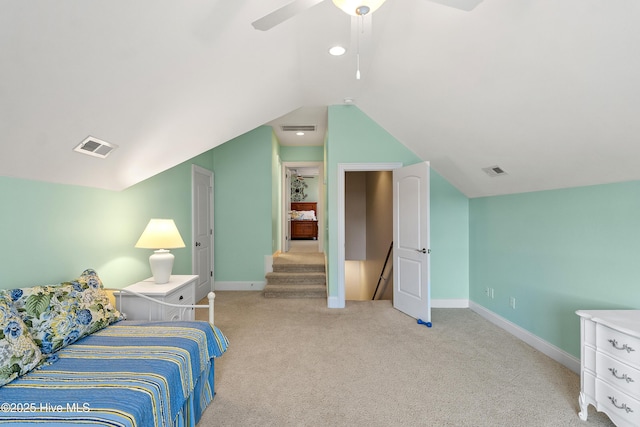 bedroom featuring ceiling fan, light colored carpet, and lofted ceiling