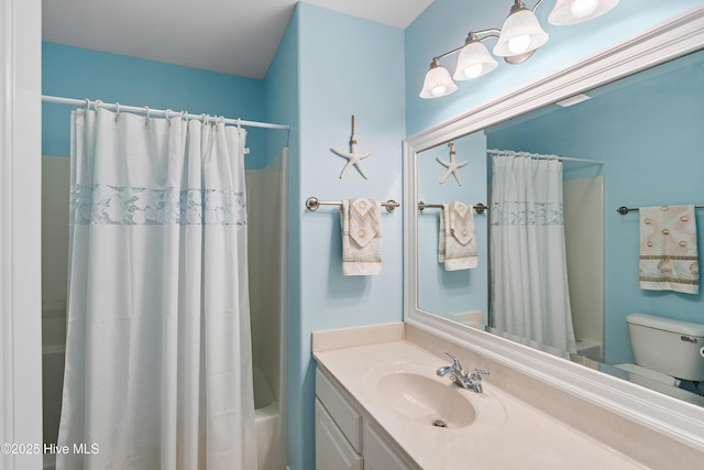 full bathroom featuring shower / bath combo, vanity, and toilet