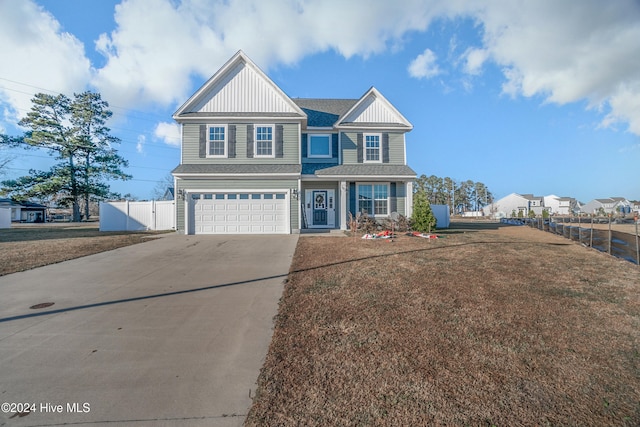 view of front facade featuring a garage and a front lawn