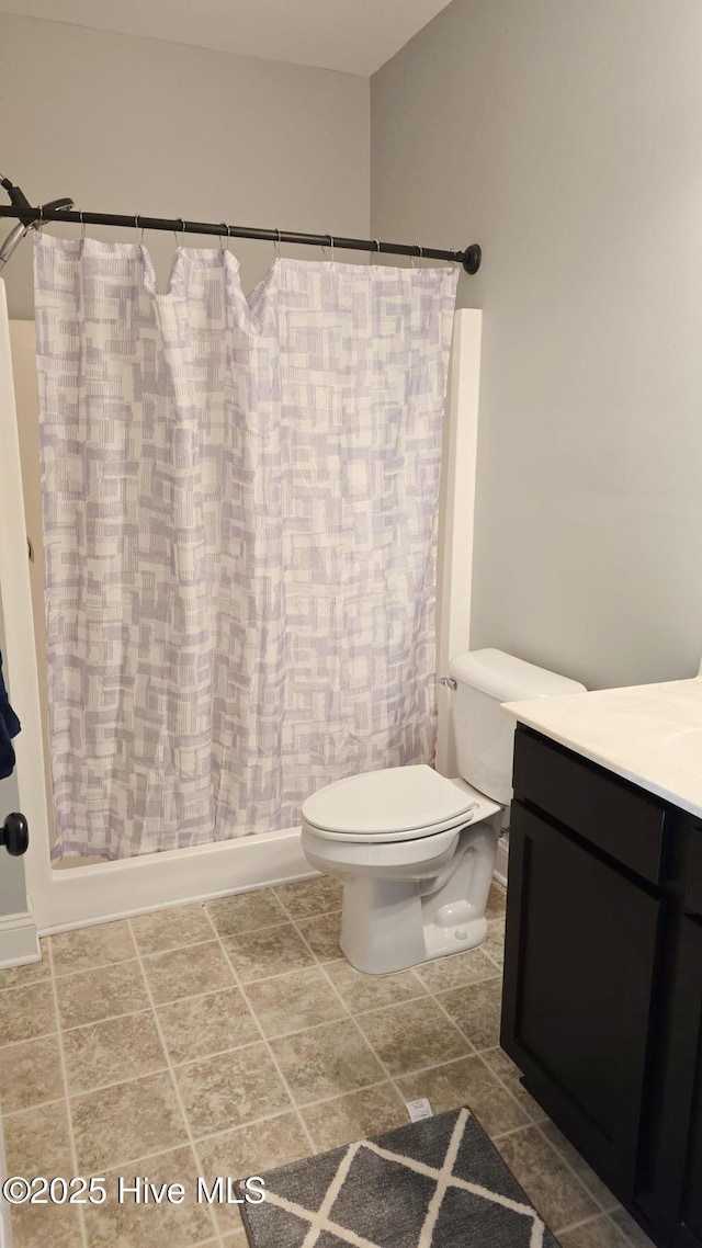 full bathroom featuring vanity, toilet, and shower / bath combo with shower curtain