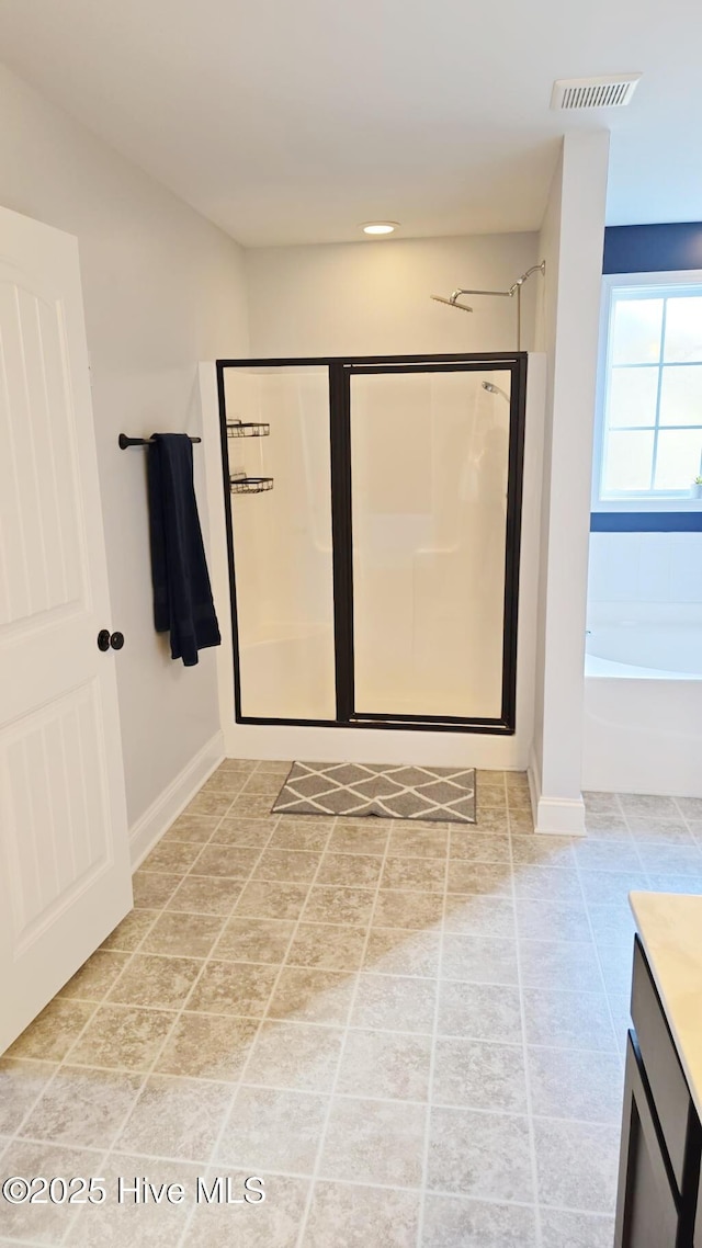 bathroom with vanity and plus walk in shower