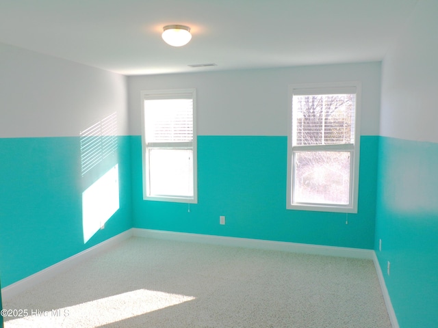 unfurnished room with carpet floors