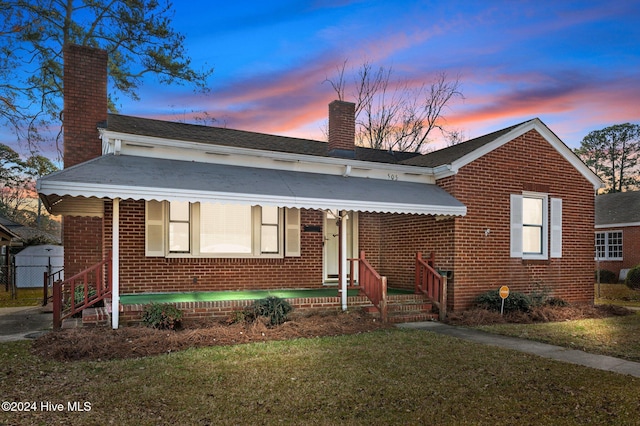 view of front of home with a lawn