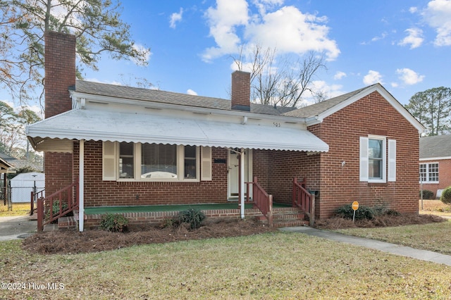 bungalow-style house featuring a front yard