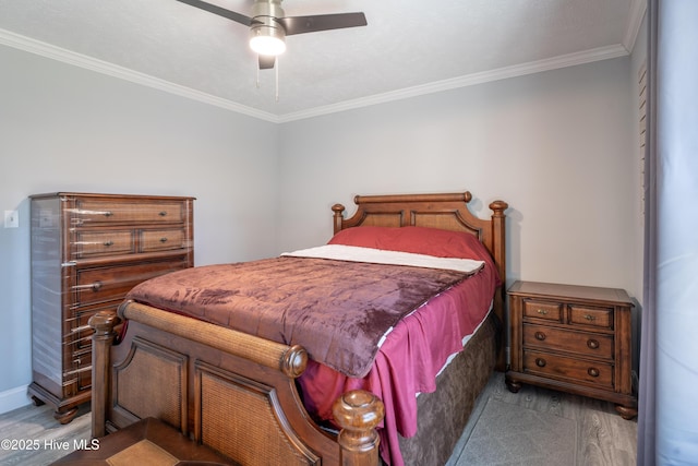 bedroom with wood-type flooring, crown molding, and ceiling fan