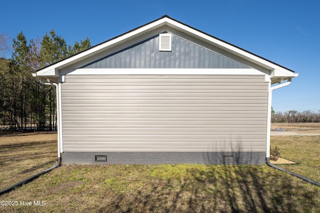 view of home's exterior with a lawn