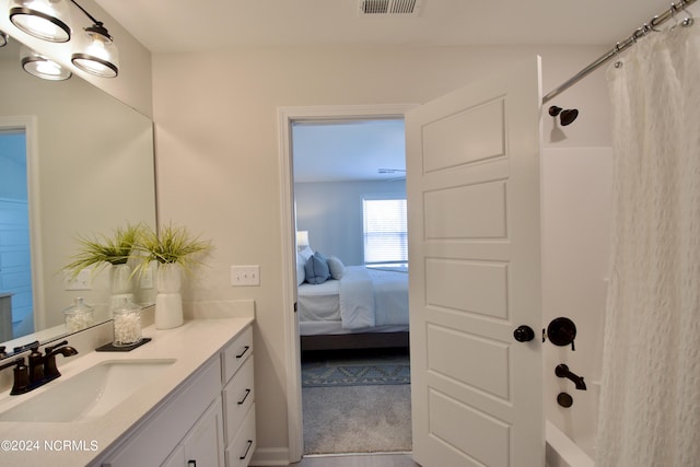 bathroom featuring a shower with shower curtain and vanity