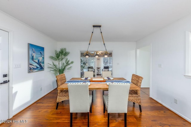 dining area featuring wood-type flooring