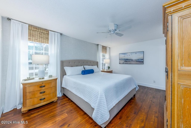 bedroom featuring ceiling fan and dark wood-type flooring