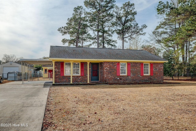 single story home with a carport and a front lawn