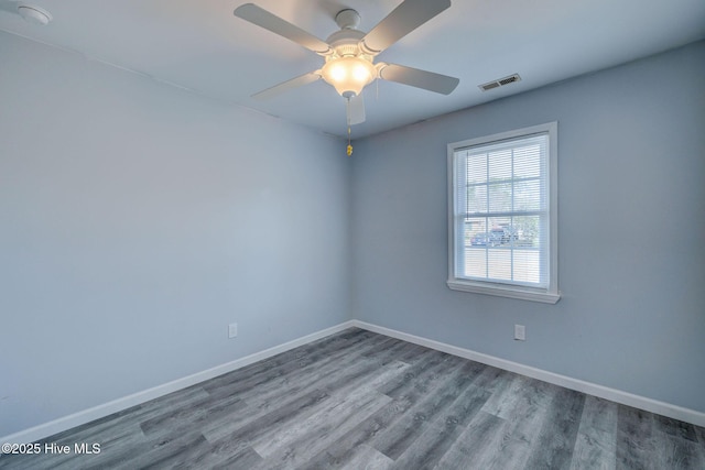 empty room featuring ceiling fan and wood-type flooring