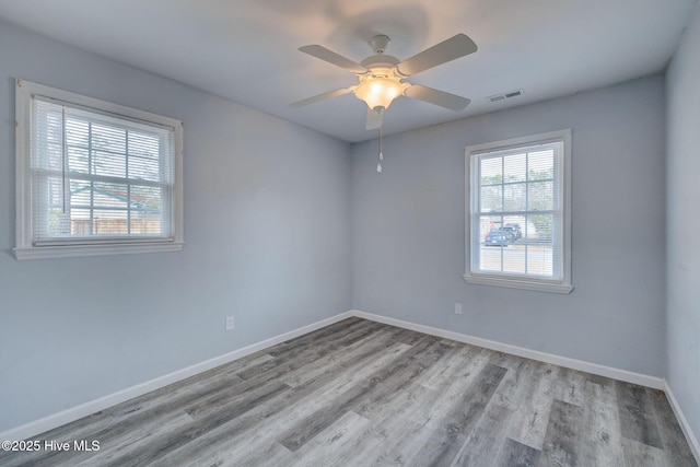 unfurnished room featuring ceiling fan and light hardwood / wood-style floors