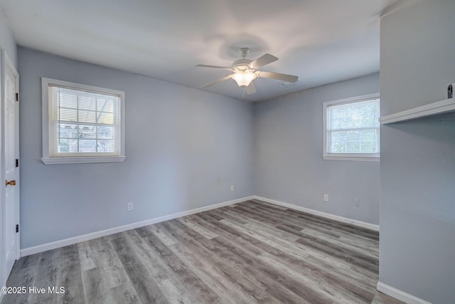 spare room featuring ceiling fan and light hardwood / wood-style flooring