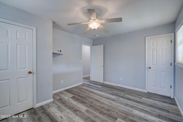 unfurnished bedroom with light hardwood / wood-style floors and ceiling fan