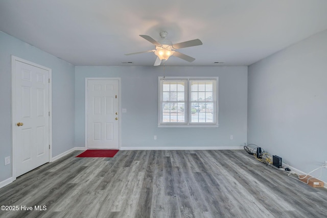 unfurnished room featuring light wood-type flooring and ceiling fan