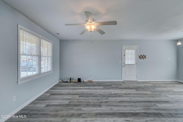 spare room featuring ceiling fan and hardwood / wood-style flooring