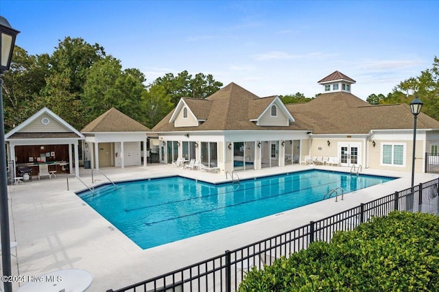 view of swimming pool with a patio