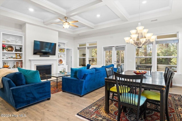 living room featuring crown molding, beam ceiling, coffered ceiling, light hardwood / wood-style floors, and french doors