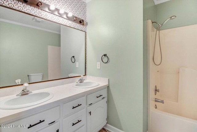 full bathroom featuring bathtub / shower combination, vanity, toilet, and crown molding