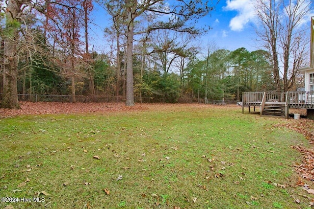 view of yard featuring a wooden deck