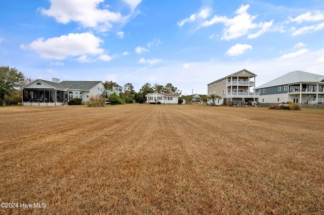 view of yard with a sunroom