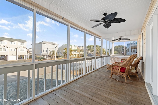 sunroom / solarium with ceiling fan