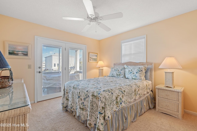 carpeted bedroom with access to outside and ceiling fan