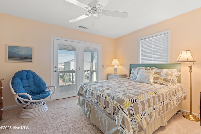 carpeted bedroom with access to exterior and ceiling fan