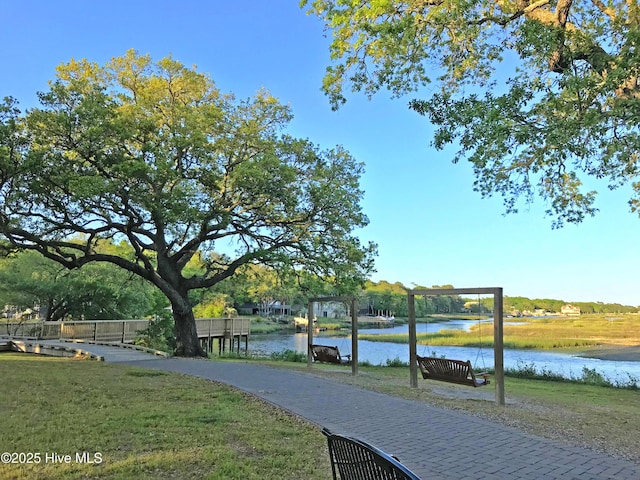 exterior space featuring a water view and a yard