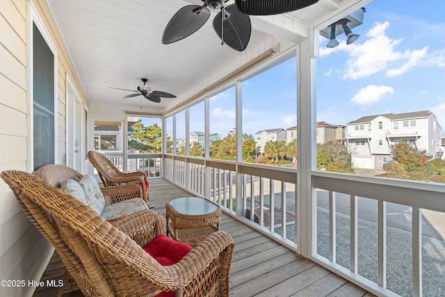 sunroom with ceiling fan