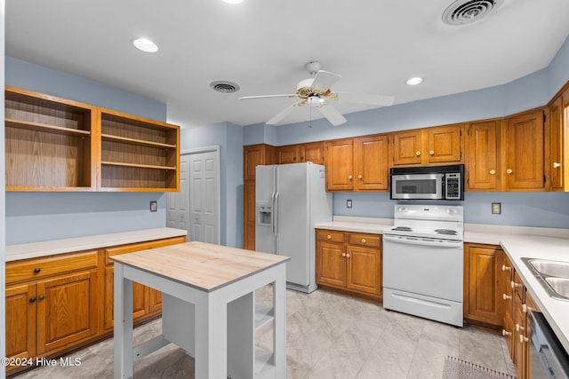 kitchen featuring ceiling fan, sink, and appliances with stainless steel finishes