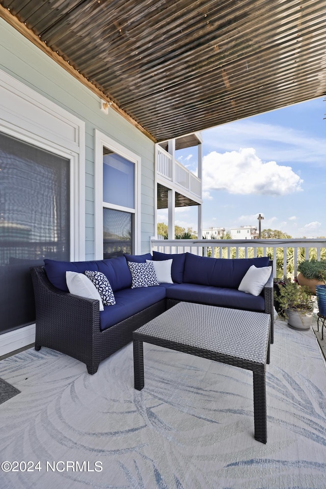 view of patio / terrace with a balcony and an outdoor hangout area