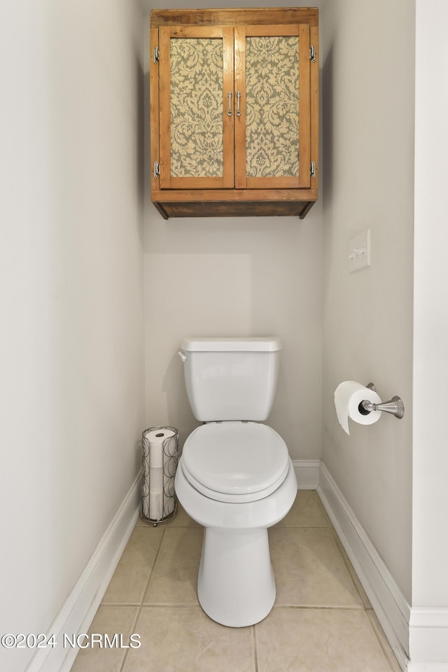 bathroom with tile patterned floors and toilet