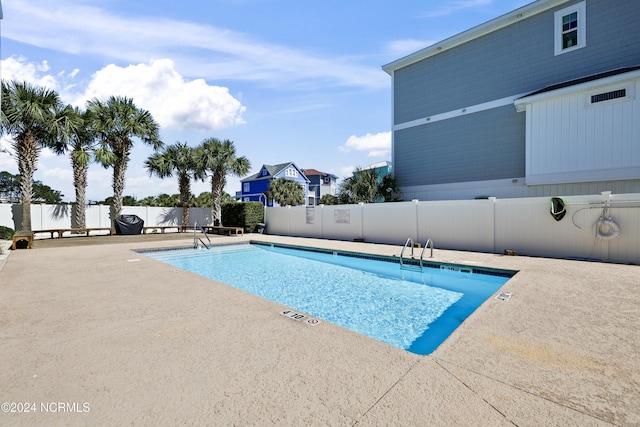 view of pool featuring a patio