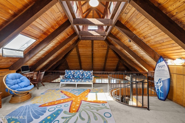 interior space featuring lofted ceiling with skylight, wooden walls, carpet floors, and wood ceiling