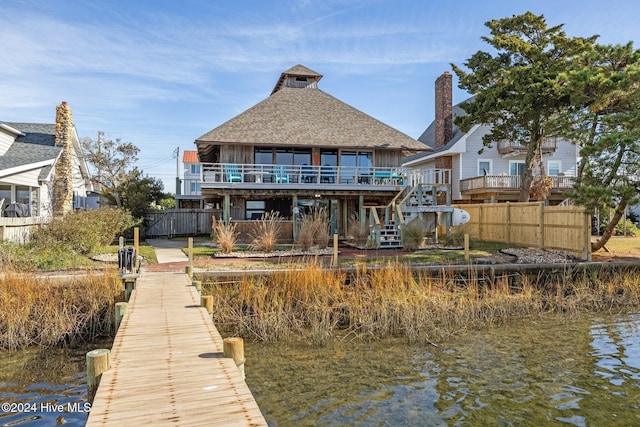 dock area with a deck with water view