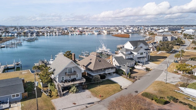 birds eye view of property with a water view