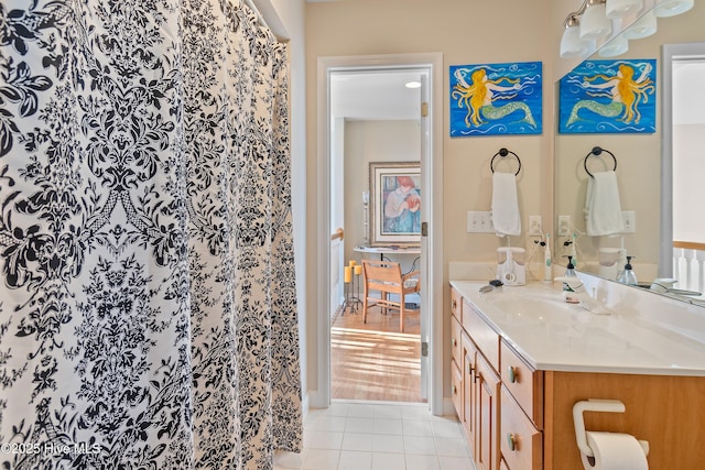 bathroom with tile patterned flooring, vanity, and a shower with shower curtain