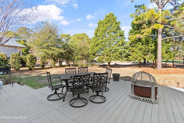 wooden deck with an outdoor fire pit