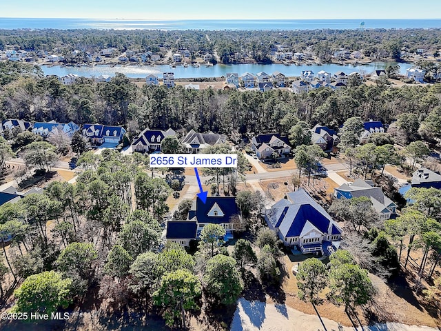 bird's eye view with a water view