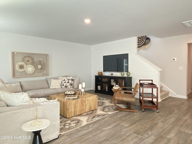 living room featuring dark wood-type flooring