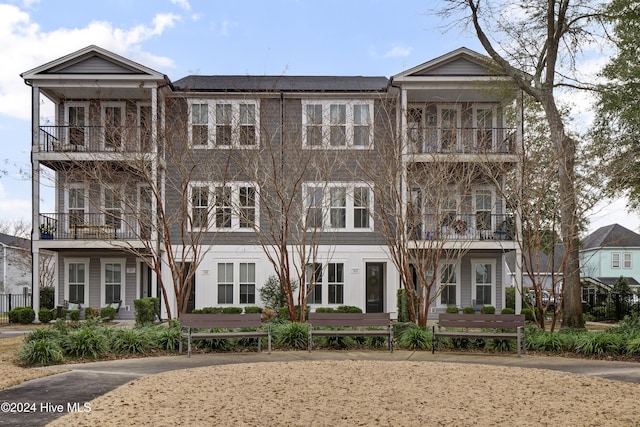 view of front of home featuring a balcony