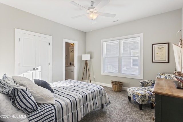 carpeted bedroom with connected bathroom, a closet, and ceiling fan